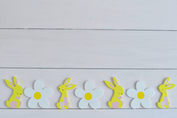 Easter wooden bunny on light background - Фото, изображение