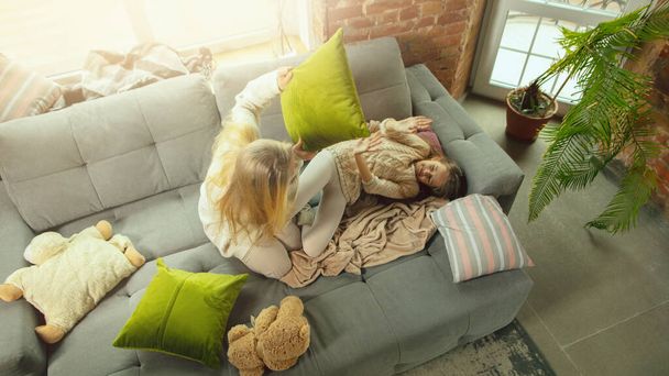Happy loving family, mother and daughter spending time together at home - Фото, изображение