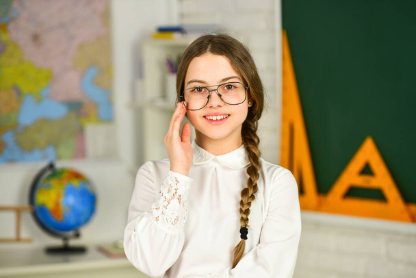 wearing glasses. autumn school time. Back to school. education in college. study geography map. mired in geometry. School girl hold at blackboard. Instrument of Measurement. different school elements - Photo, Image