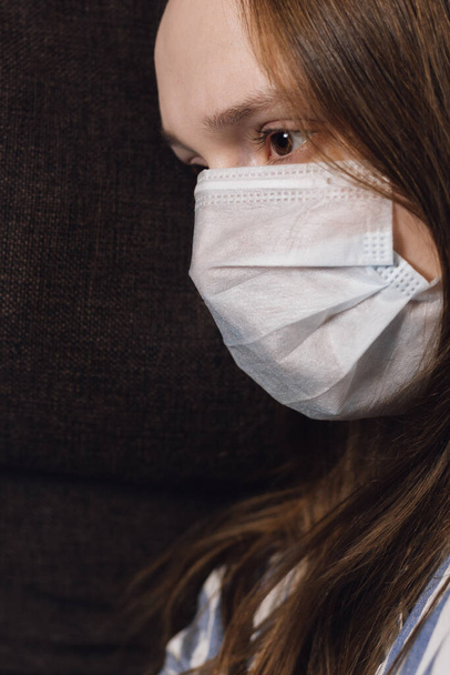 scared look of a girl in a medical mask. quarantine. prevention of the corona virus.scientist in biological protective Epidemic virus outbreak concept. COVID-19 - Foto, imagen