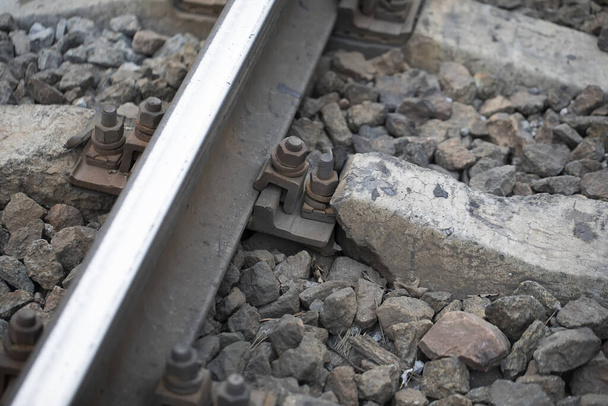 Damaged rail. Reinforced concrete support broke. - Photo, Image