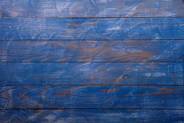 Vintage blue wood background texture with knots and nail holes. Old painted wood wall. Blue abstract background. Vintage wooden dark blue horizontal boards. Front view with copy space. Background for design. - Photo, Image