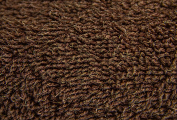 Close up van een kledingstuk van bruin katoen - Foto, afbeelding