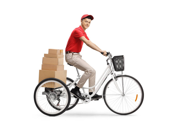 Delivery guy riding a tricycle and delivering boxes isolated on white background - Foto, imagen