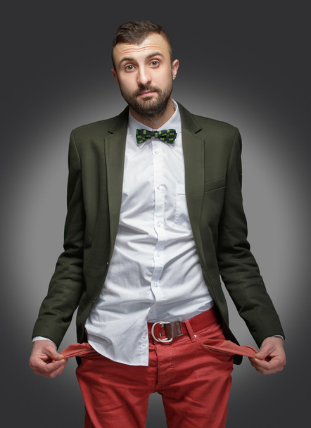 jonge man in een groen pak, geen geld - Foto, afbeelding
