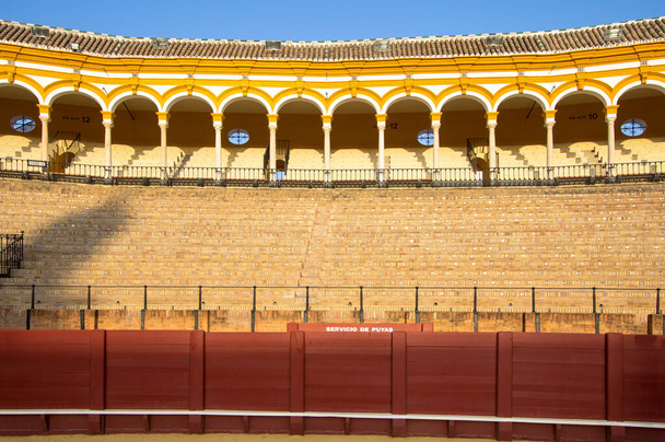 Stands in the bullring Arena Real Maestranza de Cavalry (Plaza de toros de la Real Maestranza de Caballeria) in Seville, Andalucia, Spain - Фото, изображение
