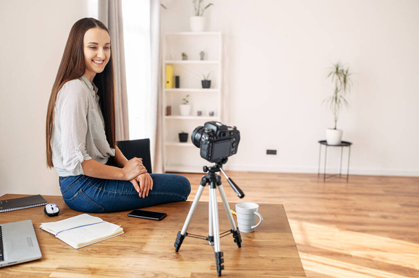 Young woman records video lessons on camera - Foto, imagen