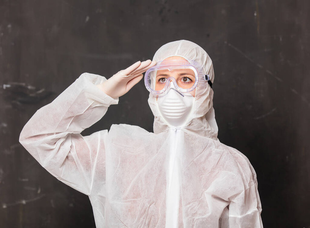 female doctor in protection suit and glasses with mask - Foto, Bild
