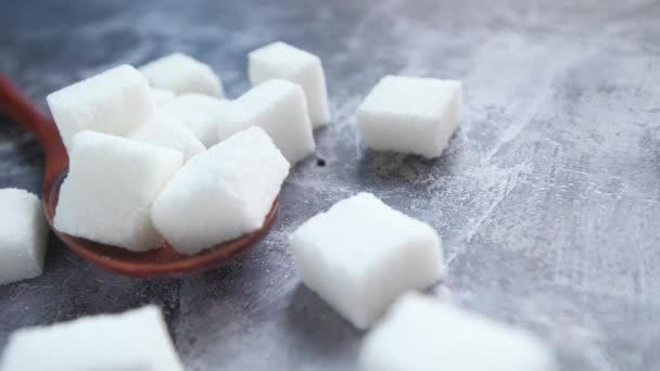 Close up of sugar cube on wooden spoon. - Footage, Video