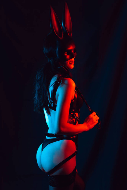 naked girl mistress dominant masked Bunny with leather whip for BDSM sex - Fotoğraf, Görsel