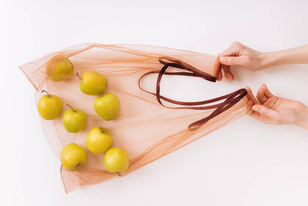 Eco packs. Eco bag with apples. Purchase without harm to nature in anti-plastic bags. Zero Waste. - Fotoğraf, Görsel
