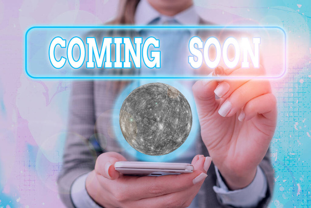 Text sign showing Coming Soon. Conceptual photo something is going to happen soon or after a short time Elements of this image furnished by NASA. - Photo, Image