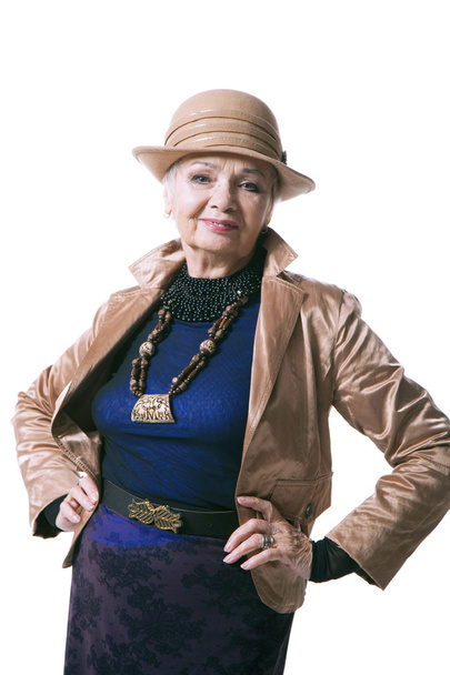 Senior blond woman in a hat with jacket - 写真・画像
