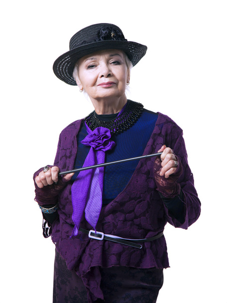 Elderly woman in a hat with a pointer - Photo, Image