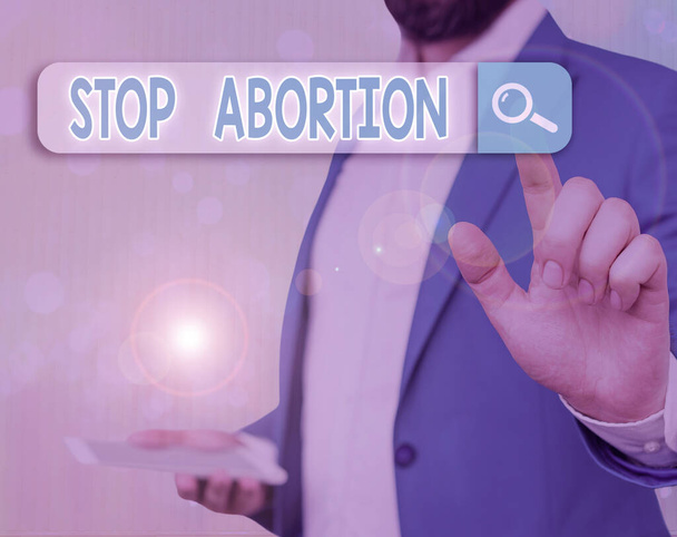 Conceptual hand writing showing Stop Abortion. Business photo text to stop medical procedure that used to end a pregnancy. - Photo, Image
