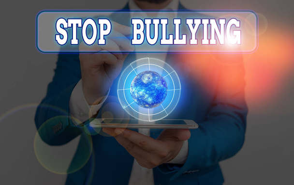Escritura de mano conceptual que muestra Stop Bullying. Texto de la foto de negocios detener el comportamiento agresivo entre los niños en edad escolar Elementos de esta imagen proporcionados por la NASA
. - Foto, imagen