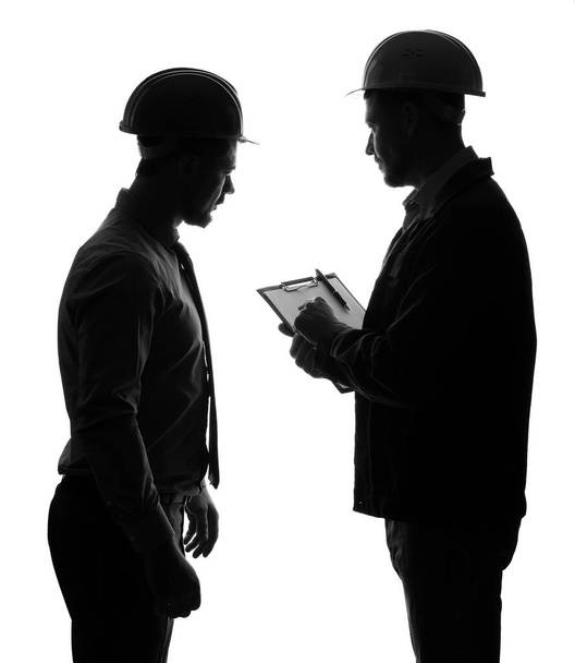 Silhouette of male engineers on white background - Photo, Image