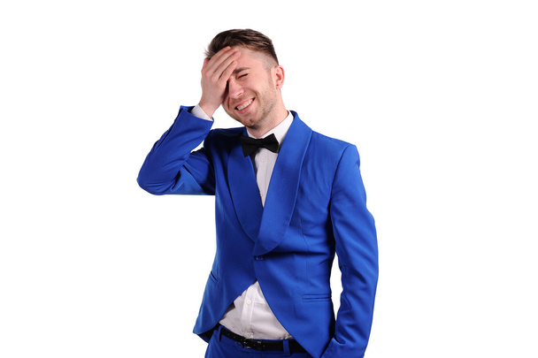 laughing man in blue suite with on white background - Foto, Imagen