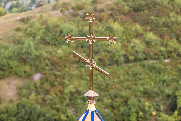 Close up on a cross of chapel on a hill near Saharna Monastery in Saharna village in Moldova - Photo, Image