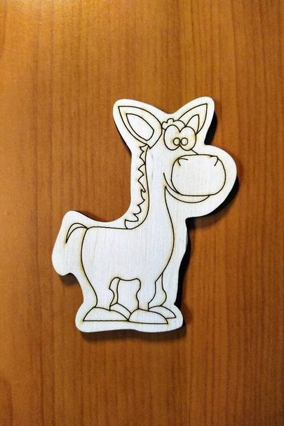 Wood donkey toy on wooden background - Photo, Image