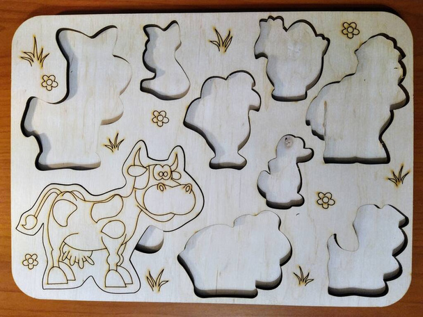 Wood board game with agricultural and home animals on wooden background - Photo, Image
