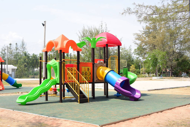 New play equipment, beautiful colors at the village playground - Photo, Image