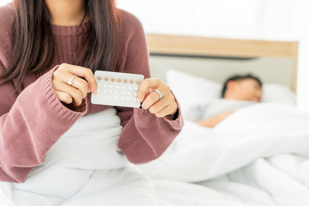 beautiful Asian women holding Birth control pill - Foto, imagen