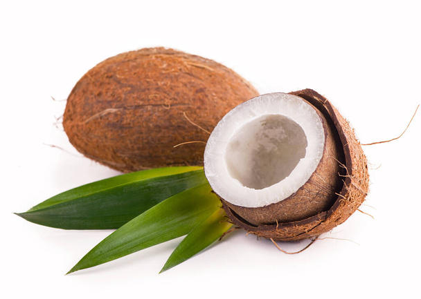 Coconut with half and leaves on white background. - Photo, Image