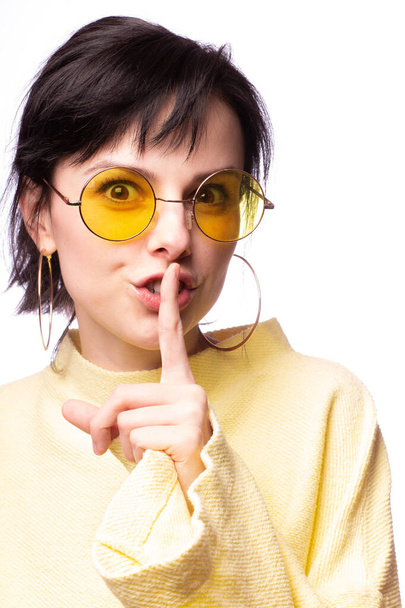 beautiful girl in yellow glasses and a yellow sweater - Photo, image