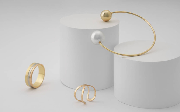 Gouden met parel armband en gouden ringen op witte achtergrond - Foto, afbeelding
