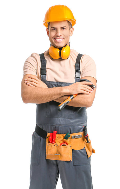 Handsome male worker on white background - Photo, Image