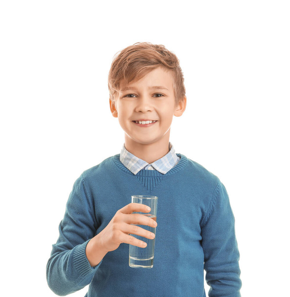 Cute little boy with glass of water on white background - Φωτογραφία, εικόνα