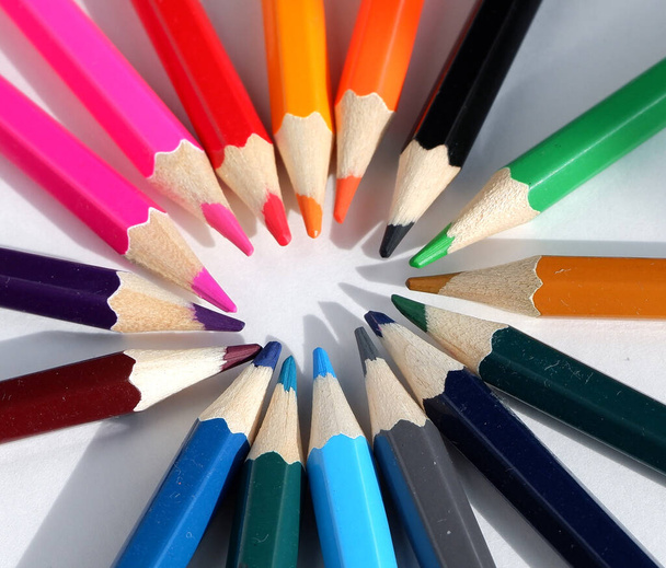 A set of colored pencils on a white background. School supplies. - Valokuva, kuva