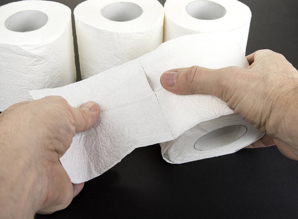 Two hands tear up toilet paper - Photo, Image