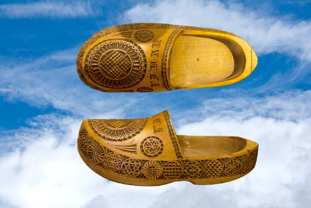 Clogs are footwear made of wood. The essences traditionally used are various types of sweet woods such as poplar, willow, maple, elm. They can be completely in wood or have a wooden sole and a leather or fabric upper - Photo, Image