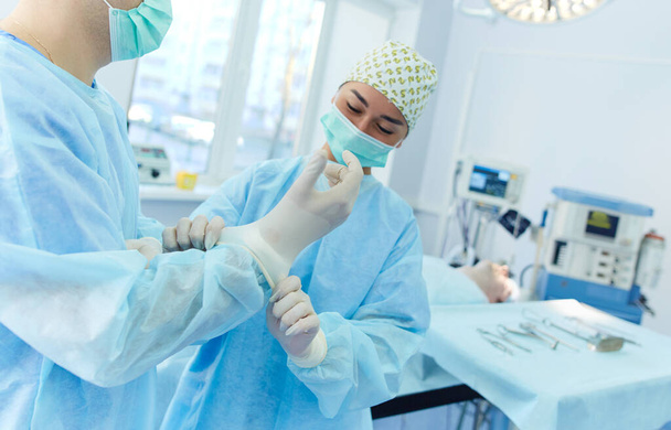 Man surgeon at work in operating room - Photo, Image