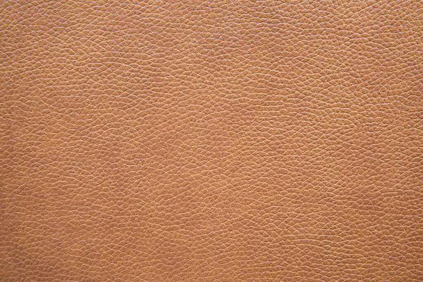 Texture of brown grained leather as a background. Natural material, top view. - Foto, imagen