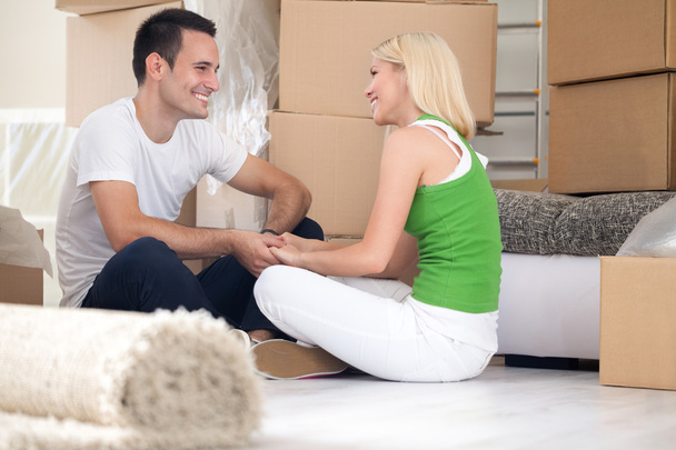 Couple sitting in new home - Photo, Image