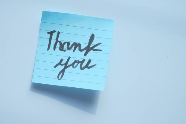 top view of thank you message on white background  - Foto, Imagem