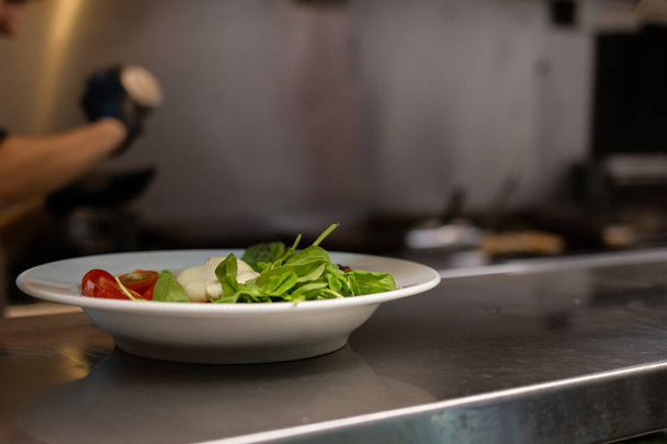 plate of fresh salad served in restaurant. waiting to be served - Photo, Image