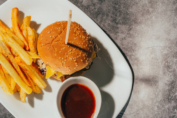 a hamburger with french fries - Fotografie, Obrázek