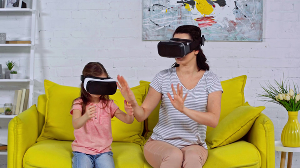 mother and daughter in virtual reality headsets  - Footage, Video