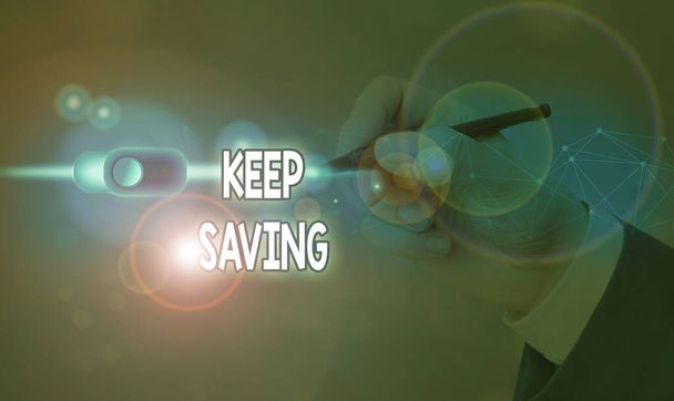 Textový rukopis Keep Saving. Koncept znamená mít peníze na účtu v bance nebo finanční organizaci. - Fotografie, Obrázek