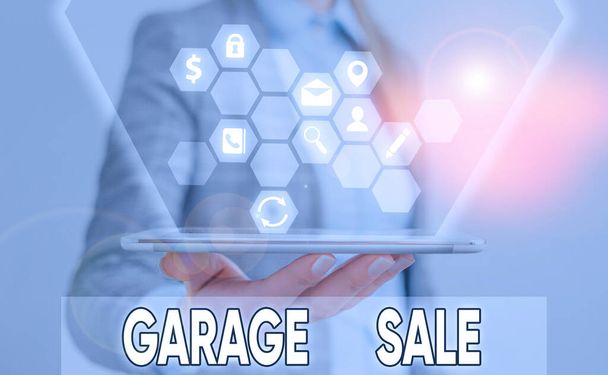 Writing note showing Garage Sale. Business photo showcasing sale of miscellaneous household goods often held in the garage. - Photo, Image