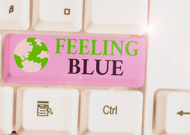 Text sign showing Feeling Blue. Conceptual photo Feeling of desperation because of sadness or missing someone. - Photo, Image