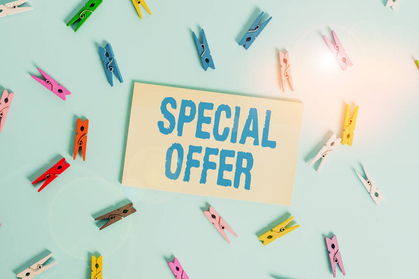 Conceptual hand writing showing Special Offer. Business photo text product or service that is offered free or at a very low price Colored clothespin rectangle shaped paper blue background. - Photo, Image