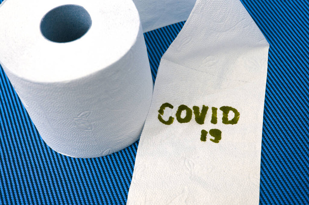 toilet paper roll with the words "covid 19" - Photo, Image