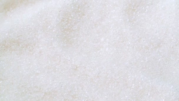 Pile of white sugar, close shot. Dolly shot of white surface of sugar heap. White sweet sugar, abstract background. - Кадры, видео
