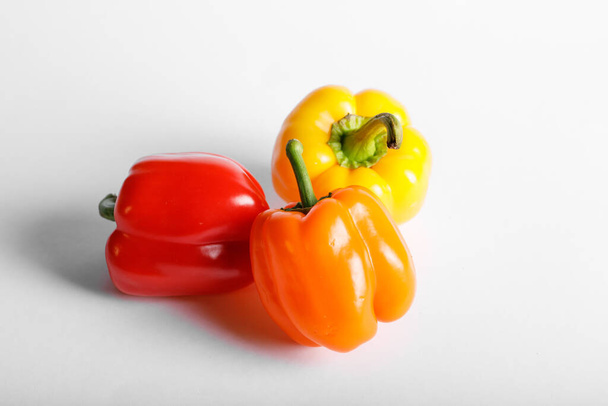 Tricolor chili paprika fehér alapon. Felülnézet - Fotó, kép