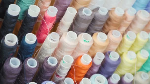 Video of colourful spools of threads in workshop - Footage, Video